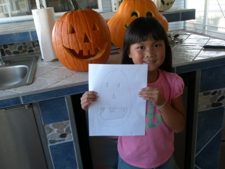 Kasen comparing pumpkin with sketched version